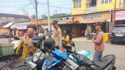 Patroli Pasar Tradisional, Polsek Lubuk Raja Imbau Pengunjung dan Tukang Parkir Tingkatkan Kewaspadaan